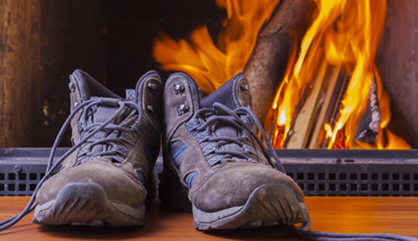 Boots by a log fire