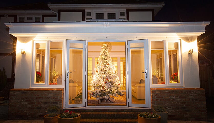 White uPVC orangery with a Christmas tree