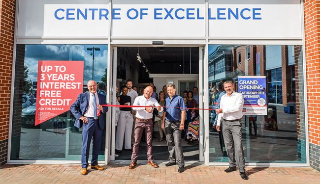 Dominic Littlewood cuts the ribbon at new showroom