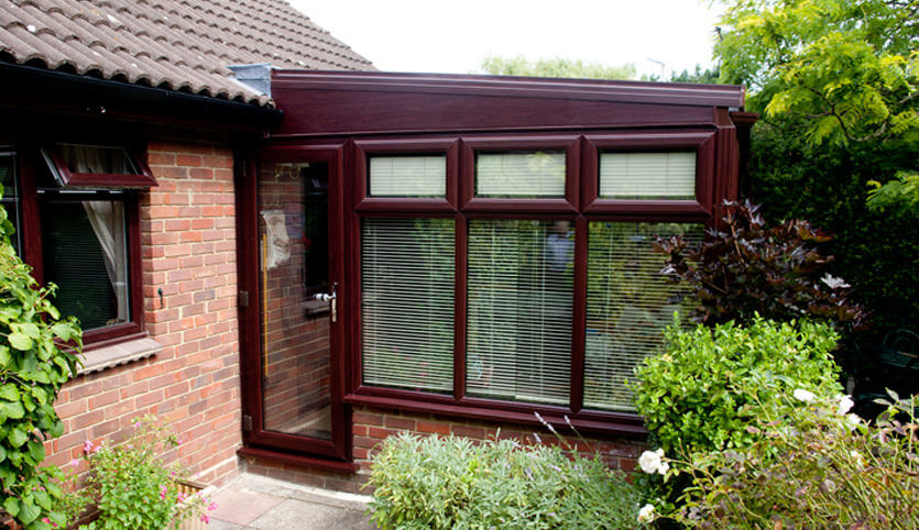 Rosewood stained hardwood lean-to conservatory
