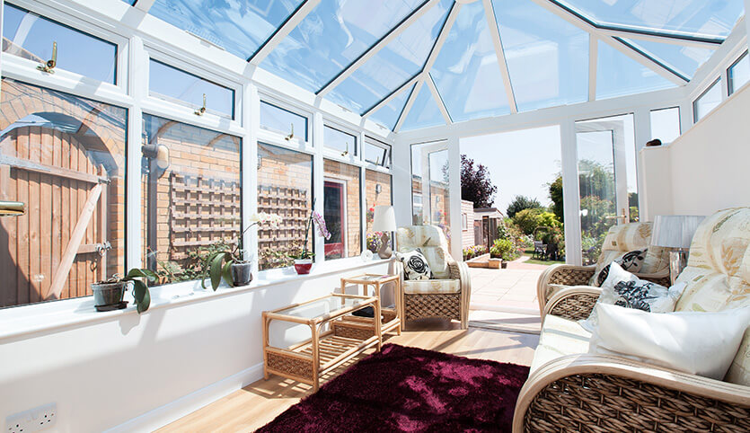 White Edwardian conservatory with a glass roof
