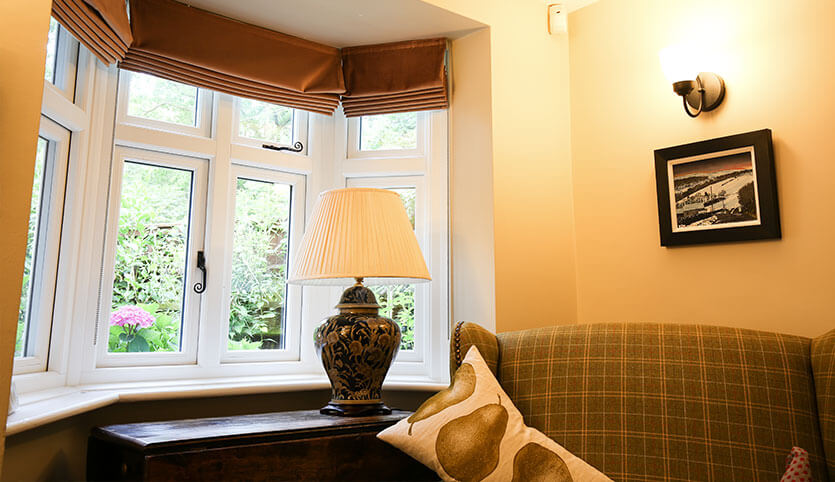 A single bay style window to replace old living room windows