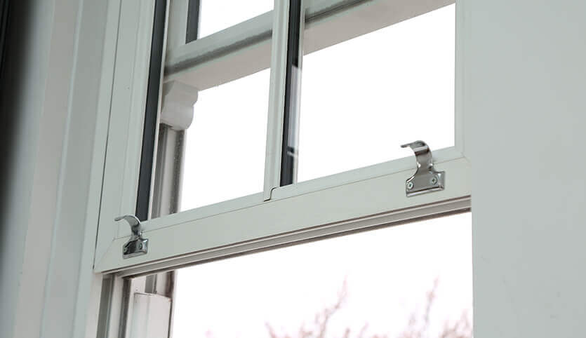 A close up photo of a sliding sash window installation