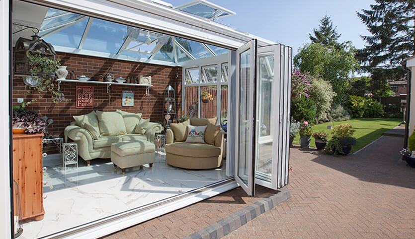 Open white uPVC bifold door