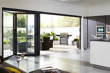 Black aluminium bifold doors installed in a kitchen