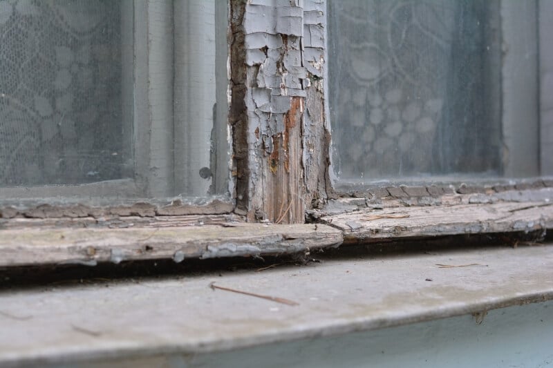 Old cracking wooden window frames.