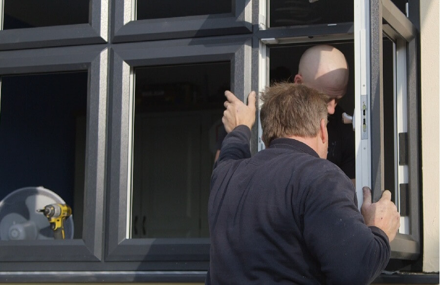 Two people who identifies as men Installation windows.