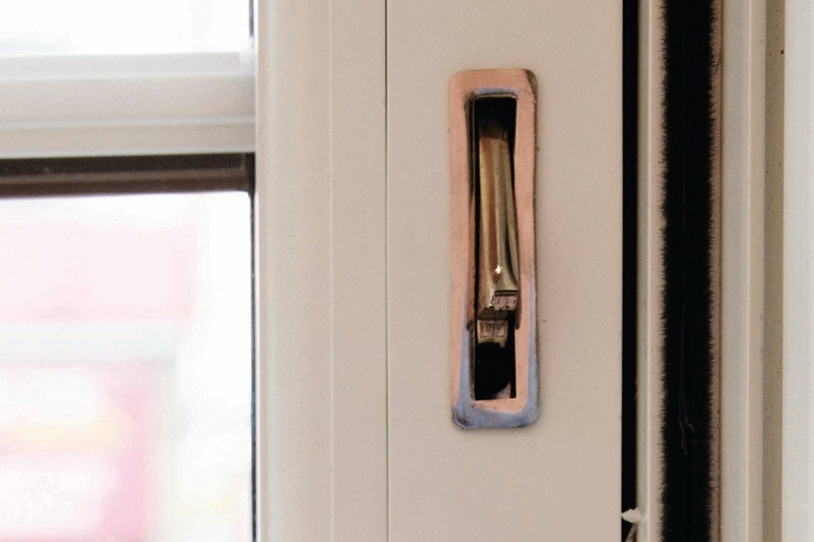close up of a Travel restrictors are typically found on sliding sash windows.