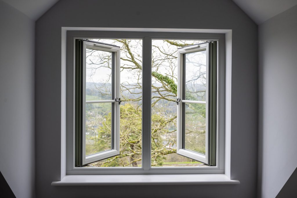 Residence 9 chalk white opened windows looking to a scenic view