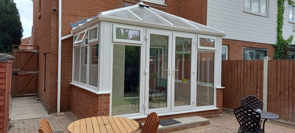 white pvc conservatory with glass roof