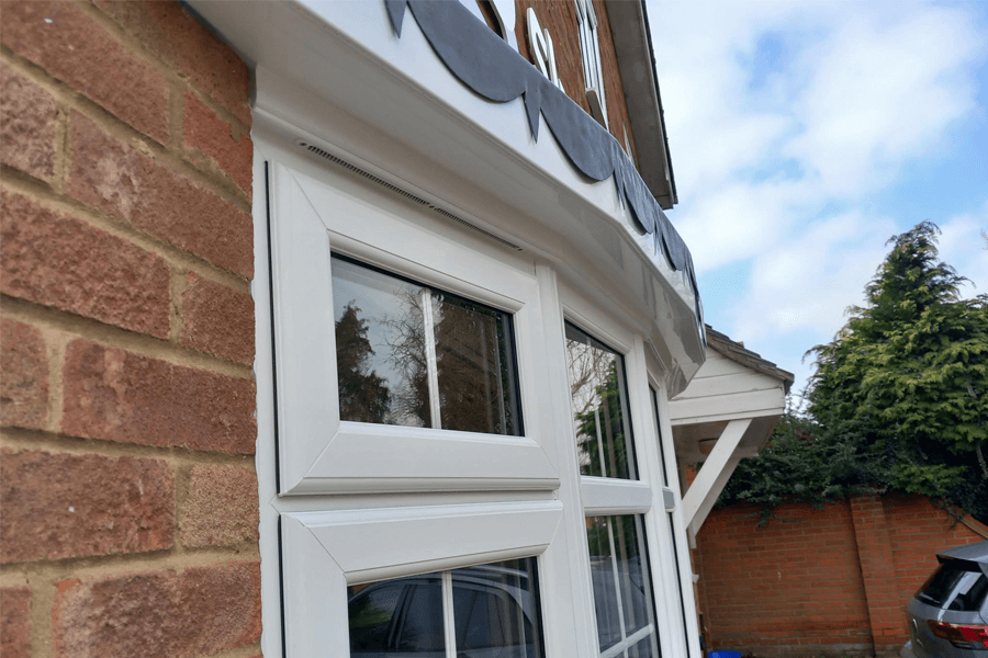 Window with an overhead concealed vent