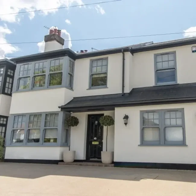 Grey vertical sliding windows totally transform Essex home