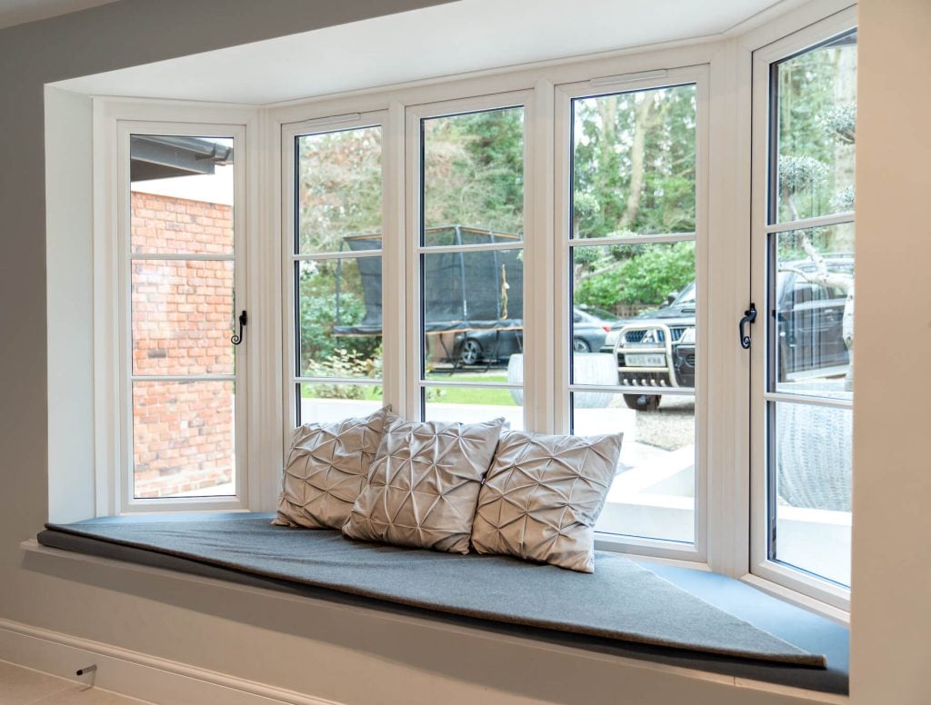 Flush sash bay windows with monkey tail handles